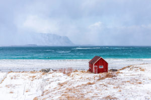 Red Beach House Awaiting Snowstorm Norway - Lofoten Islands